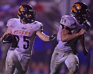 BERLIN CENTER, OHIO - OCTOBER 5, 2018: Springfield's Luke Snyder follows the block of Zachary Stouffer on his way to scoring a touchdown during the second half of their game, Friday night at Western Reserve High School. DAVID DERMER | THE VINDICATOR