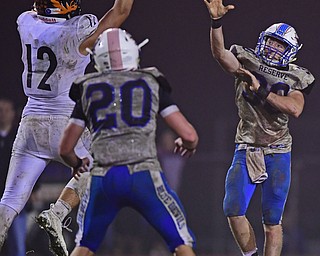 BERLIN CENTER, OHIO - OCTOBER 5, 2018: Western Reserve's Ryan Slaven attempts to throw a pass to Brandon Jarvis but the ball will be tipped by Springfield's Shane Eynon during the second half of their game, Friday night at Western Reserve High School. DAVID DERMER | THE VINDICATOR