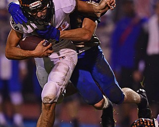 BERLIN CENTER, OHIO - OCTOBER 5, 2018: Springfield's Daniel Polonus is tackled by Western Reserve's Josh Miller during the second half of their game, Friday night at Western Reserve High School. DAVID DERMER | THE VINDICATOR