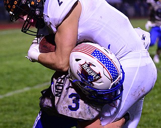 BERLIN CENTER, OHIO - OCTOBER 5, 2018: Springfield's Evan Ohlin is hit by Western Reserve's Todd Henning after a reception during the second half of their game, Friday night at Western Reserve High School. DAVID DERMER | THE VINDICATOR