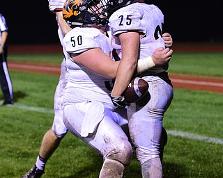 BERLIN CENTER, OHIO - OCTOBER 5, 2018: Springfield's Luke Snyder is congratulated by Brady Brungard after scoring a touchdown during the second half of their game, Friday night at Western Reserve High School. DAVID DERMER | THE VINDICATOR