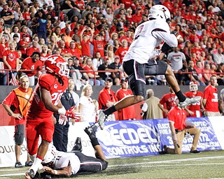 Southern Illinois's Jeremy Chinn intercepts the ball from YSU during the first half of their game at Stambaugh Stadium on Saturday. EMILY MATTHEWS | THE VINDICATOR