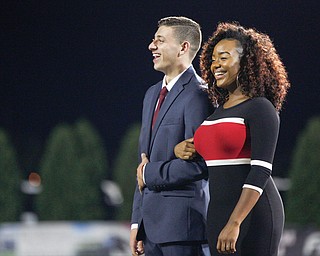 Brent Skall and Shauntiaonia Johnson walk onto the field before being named the 2018 homecoming king and queen on Saturday. EMILY MATTHEWS | THE VINDICATOR