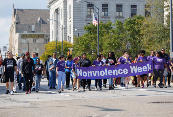 Participants in the Nonviolence Week parade march down Front Street on Sunday afternoon. The parade was the kickoff for Nonviolence week in Youngstown. EMILY MATTHEWS | THE VINDICATOR