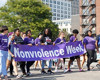 Participants in the Nonviolence Week parade march down Front Street on Sunday afternoon. The parade was the kickoff for Nonviolence week in Youngstown. EMILY MATTHEWS | THE VINDICATOR