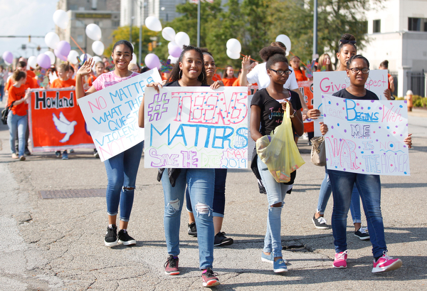 Participants in the Nonviolence Week parade march down Front Street on Sunday afternoon. The parade was the kickoff for Nonviolence week in Youngstown. EMILY MATTHEWS | THE VINDICATOR