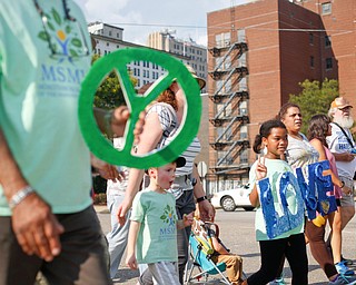 Participants with the Montessori School of the Mahoning Valley march in the Nonviolence Week parade on Sunday afternoon. The parade was the kickoff for Nonviolence week in Youngstown. EMILY MATTHEWS | THE VINDICATOR