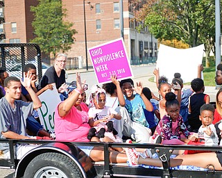 Participants in the Nonviolence Week parade make their way down Front Street on Sunday afternoon. The parade was the kickoff for Nonviolence week in Youngstown. EMILY MATTHEWS | THE VINDICATOR