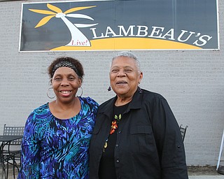 Minnijean Brown Trickey, right, one of the Little Rock Nine, stopped for a social hour at Flambeau’s on Market Street, and is shown with the owner Sandra Murphy. 