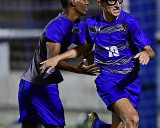 HUBBARD, OHIO - OCTOBER 9, 2018: Hubbard's AJ Trobek, right, celebrates with Derrick Cobbin after coring a goal during the first half of their game, Tuesday night at Hubbard Eagles Stadium. DAVID DERMER | THE VINDICATOR