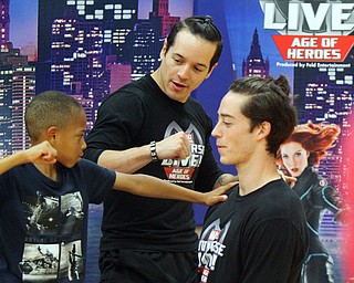 William D. Lewis The vindicator Brendon Ballard, 9, of Hermitage whose mother is master sgt Lacey Harris at YARS, gets training from Marvel Universe Live characters Nick Nieves, left, and Connor Vansandt during an event 10-10-18 at YARS.