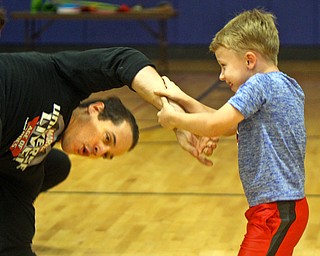 William D. Lewis The Vindicator Lincoln Caldwell, 7, whose mom is master sgt Lisa Caldwell at YARS flips Marvel Universe Live character Nick Nieves during 10-10-18 event at YARS.
