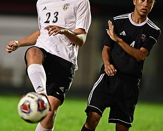 CAMPBELL, OHIO - OCTOBER 9, 2018: Crestview's Dale McGoogan kicks the ball away from Campbell's Victor Orozco during the first half of their game, Wednesday night at Campbell High School. DAVID DERMER | THE VINDICATOR