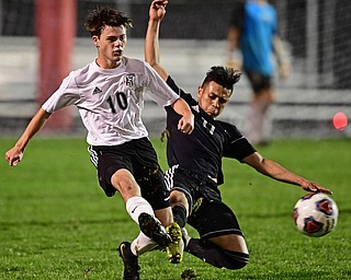 CAMPBELL, OHIO - OCTOBER 9, 2018: Crestview's Daven Manley kicks the ball away from Campbell's Henry Perdomo Mejia during the first half of their game, Wednesday night at Campbell High School. DAVID DERMER | THE VINDICATOR