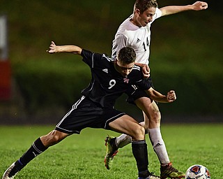 CAMPBELL, OHIO - OCTOBER 9, 2018: Campbell's Petros Atsas and Crestview's Colt Crane battle for the ball during the first half of their game, Wednesday night at Campbell High School. DAVID DERMER | THE VINDICATOR