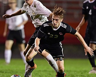 CAMPBELL, OHIO - OCTOBER 9, 2018: Campbell's Giovanni Lisi kicks the ball away from Crestview's Colt Crane during the first half of their game, Wednesday night at Campbell High School. DAVID DERMER | THE VINDICATOR