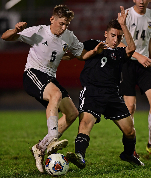CAMPBELL, OHIO - OCTOBER 9, 2018: Cresview's Cutter Crane and Campbell's Petros Atsas battle for the ball during the first half of their game, Wednesday night at Campbell High School. DAVID DERMER | THE VINDICATOR