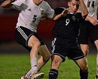 CAMPBELL, OHIO - OCTOBER 9, 2018: Cresview's Cutter Crane and Campbell's Petros Atsas battle for the ball during the first half of their game, Wednesday night at Campbell High School. DAVID DERMER | THE VINDICATOR
