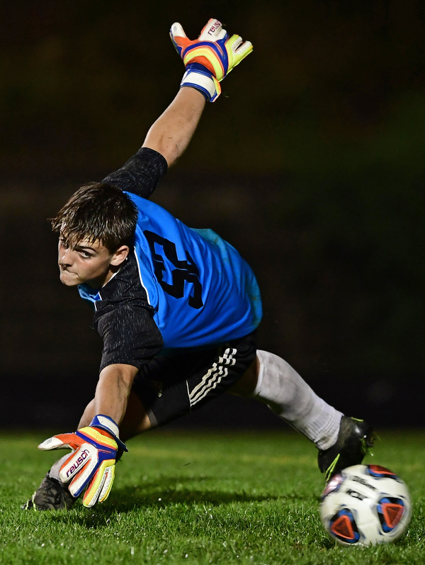 CAMPBELL, OHIO - OCTOBER 9, 2018: Crestview goalie Carter Blakeman dives in an unsuccessful attempt to prevent a goal scored by Campbell's Henry Perdomo Mejia  during the first half of their game, Wednesday night at Campbell High School. DAVID DERMER | THE VINDICATOR