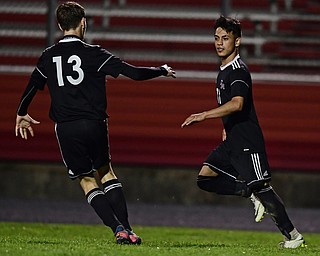 CAMPBELL, OHIO - OCTOBER 9, 2018: Campbell's Henry Perdomo Mejia, right, is congratulated by Gabe Lisi after scoring a goal during the first half of their game, Wednesday night at Campbell High School. DAVID DERMER | THE VINDICATOR
