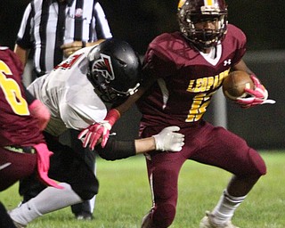 William D. Lewis The Vindicator  Liberty's Donte Venters(12) eludes a Jefferson defender during 10-11-18 action at Liberty.