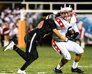 DIANNA OATRIDGE | THE VINDICATOR Howland's Anthony  Ciarrochi (19) takes down Niles' Seth McMillion (5) during their game at Lombardo Field on Thursday.