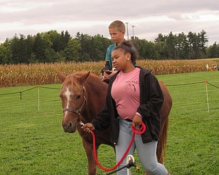 Neighbors | Jessica Harker.Mark Horvath took a pony ride at the MetroParks Farms annual Sunset at the Farm event Sept. 22.