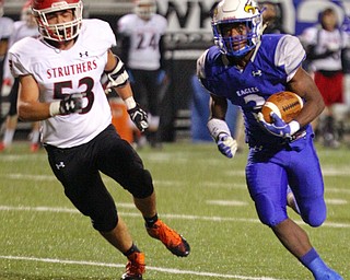 William D Lewis The Vindicator  Hubbard's Jermia Harris(3)) eludes Struthers Brandon Kistler(53) during 10-12-18 action at Hubbard.