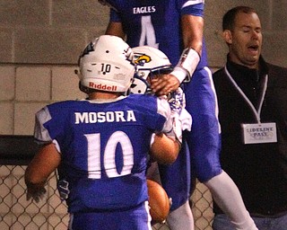 William D. LeiwsThe Vindicator  Hubbard's JayQuab Odem(1) gets congratulated from Lukas Mosora(10) and Davion Daniels (4) after scoring during 10-12-18 game with Struthers.