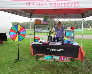 Neighbors | Jessica Harker.Kerrie Rybicki sold her Tupperware at the Austintown Park on Oct. 6 during the Woodside Community Gardens Oktoberfest event.