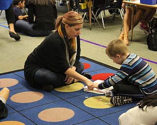 Neighbors | Abby Slanker.A C.H. Campbell Elementary School kindergarten played a math game in his classroom with his mother during Canfield Local School District Math Night on Oct. 4.