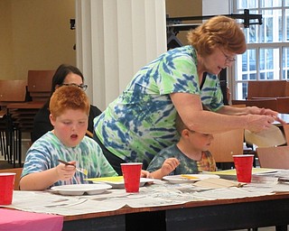 Neighbors | Jessica Harker.Kindergarten through fifth-grade children attended the Halloween Paint Party at the Poland library where they painted canvas' with a yellow back round and then traced stencils of pumpkins.