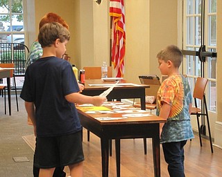Neighbors | Jessica Harker.Librarians had stencils spread out for children to choose from to trace at the Poland libraries Halloween Paint Party on Oct. 2.