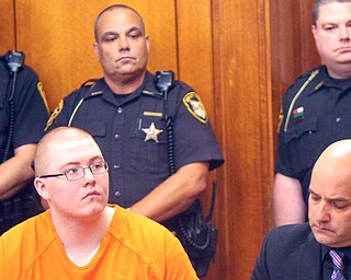 Jacob LaRosa of Niles, left, listens as a judge in Trumbull County
Common Pleas Court sentences him to life in prison without parole for the murder of his 94-year-old neighbor in 2015. At right is defense lawyer David Rouzzo.
