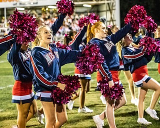 DIANNA OATRIDGE | THE VINDICATOR Niles'cheerleaders fire up the crowd during their games versus Howland at Lombardo Field on Thursday.