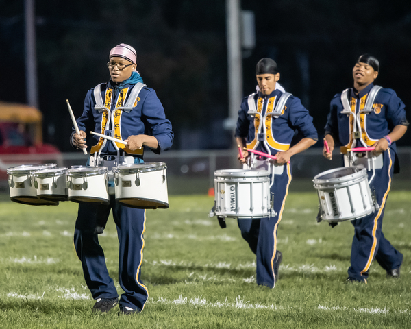 DIANNA OATRIDGE | THE VINDICATOR The Golden Bear drumline plays a cadence as they exit the field prior to the Youngstown East versus Canfield game in Rayen Stadium in Youngstown on Friday.