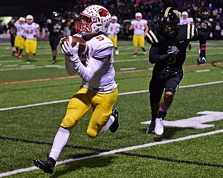 WARREN, OHIO - OCTOBER 12, 2018: Mooney's Nico Marchionda catches a pass after getting behind Harding's Alex Payiavlas during the first half of their game, Friday night at Warren Harding High School. DAVID DERMER | THE VINDICATOR