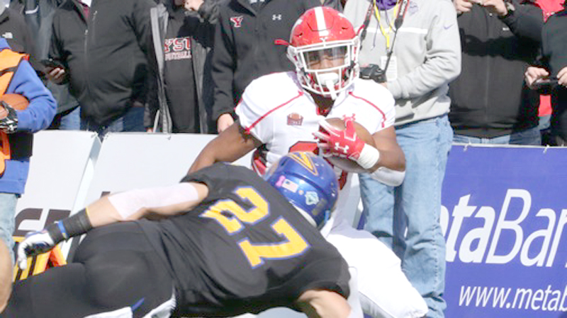 Youngstown State University running back Christian Turner sidesteps South Dakota State safety Brandon Snyder after making a catch for a 27-yard touchdown during the first quarter of their game Saturday at Dana J. Dykhouse Stadium in Brookings, S.D. The Jackrabbits defeated the Penguins 36-7. 