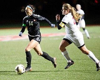 Mooney's Bre Evans runs the ball past Struthers and toward the goal during their game at Farmers National Bank Soccer Field on Monday. EMILY MATTHEWS | THE VINDICATOR