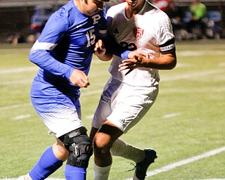 Poland's Bailey Swogger tries to keep the ball away from Niles' Ethan Shaffer during the first half of their game at Poland on Tuesday. EMILY MATTHEWS | THE VINDICATOR