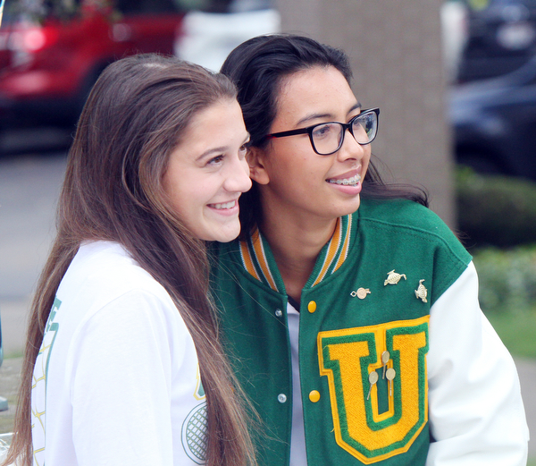 William D. Lewis The Vindicator  Ursuline tennis players Lexie Tsudis, left, and Vy Hoang during a sendoff rally at their school 10-17-18 before they head to state tennis tounrament.