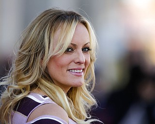 In this Oct. 11, 2018, photo, adult film actress Stormy Daniels attends the opening of the adult entertainment fair 'Venus' in Berlin, Germany. When President Donald Trump called Daniels “horseface” on Twitter, he added to his long list of creative, some say misogynistic, descriptions for women. A look at how Trump’s words, and his attitude, might play out three weeks before an election that features a record number of women candidates