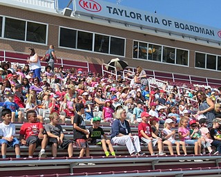 Neighbors | Jessica Harker.Elementary school students sat in Spartan Stadium Sept. 19 to listen to the Boardman high school marching band perform.