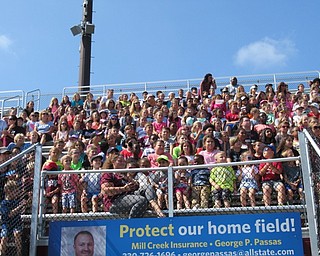 Neighbors | Jessica Harker.Elementary school students sat in Spartan Stadium Sept. 19 to watch to the Boardman high school marching band perform their half time show.