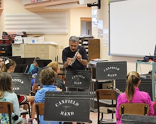 Neighbors | Abby Slanker.Al Colella, retired band director at Poland Seminary High School, instructed the Canfield Village Middle School fifth-grade band clarinet group during Jump Start lessons on Sept. 28.