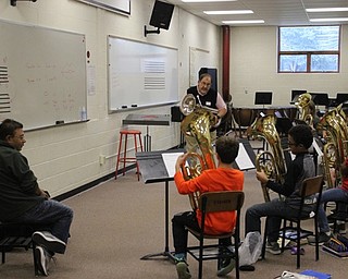 Neighbors | Abby Slanker.A Canfield Village Middle School parent looked on as Tom Brucoli, retired band director of Champion High School, instructed the baritones group of the school’s fifth-grade band during Jump Start lessons.