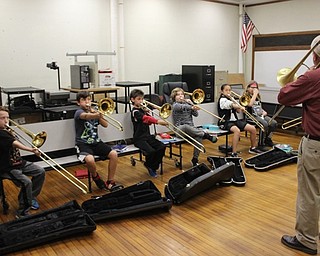 Neighbors | Abby Slanker.Bill Forrester, retired band director of Hubbard High School, instructed the Canfield Village Middle School fifth-grade band trombone group on Sept. 28.
