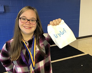 Neighbors | Submitted.Kindness club member Christin Murcko handed out bags of popcorn to students at Poland Seminary High School Sept. 27 as part of the Start with Hello week events.