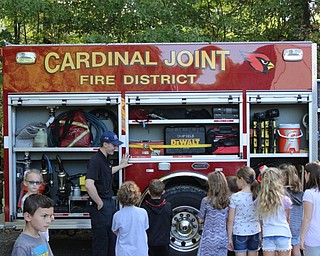 Neighbors | Abby Slanker.Cardinal Joint Fire District firefighter/EMT Jonathan Hutchison explained the fire truck’s equipment to the Hilltop Elementary School third-grade students and showed them the tools firefighters use as a part of Fire Safety Week.