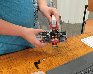 Neighbors | Jessica Harker.The full gripper portion of the Lego Mindstorm GRIPP3R robot built by Israel Zink, a fourth-grader, at the Poland library on Oct. 11.